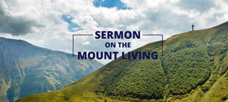 Mountainous valley filled with greenery and a cross at the top. Text over image reads "Sermon on the mount living"